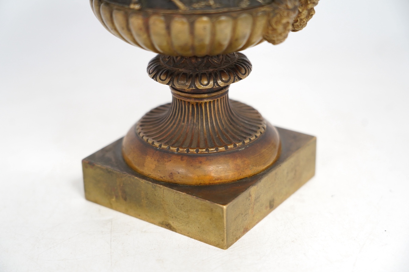 A mid 19th century bronze campana urn with classical figures, 22cm high. Condition - good